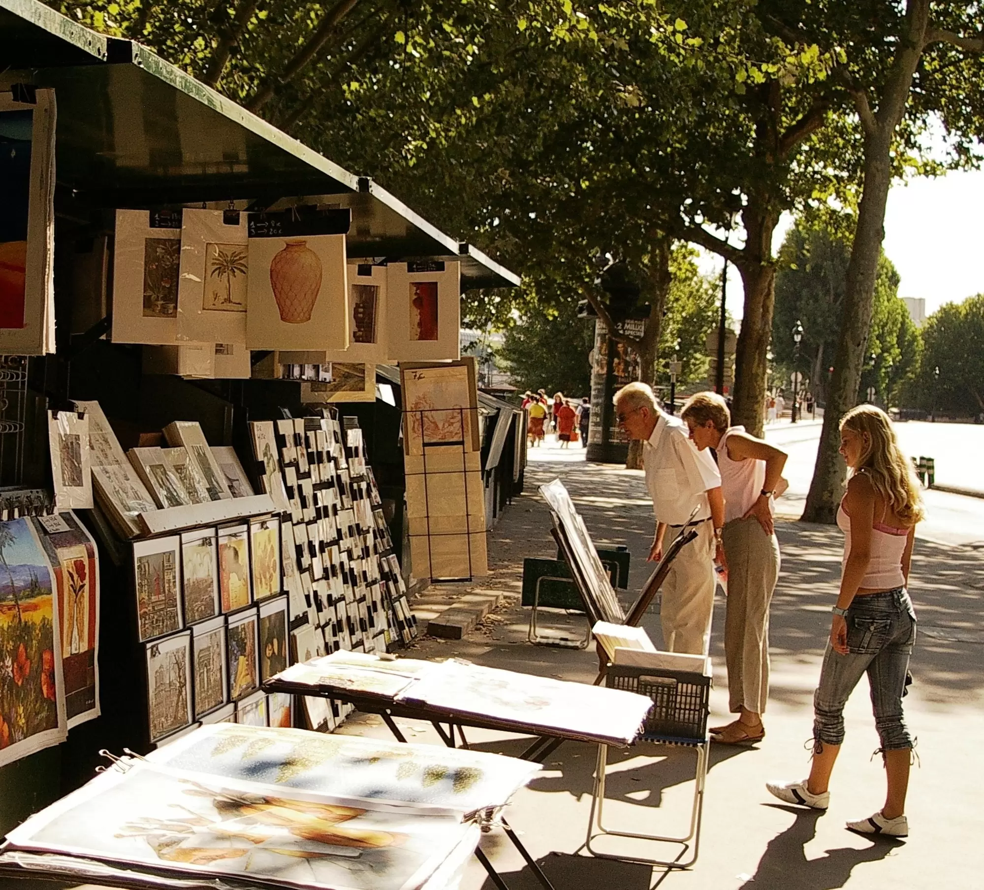 Sellers line the streets of Paris in sunny weather. Dana Ward / Shutterstock