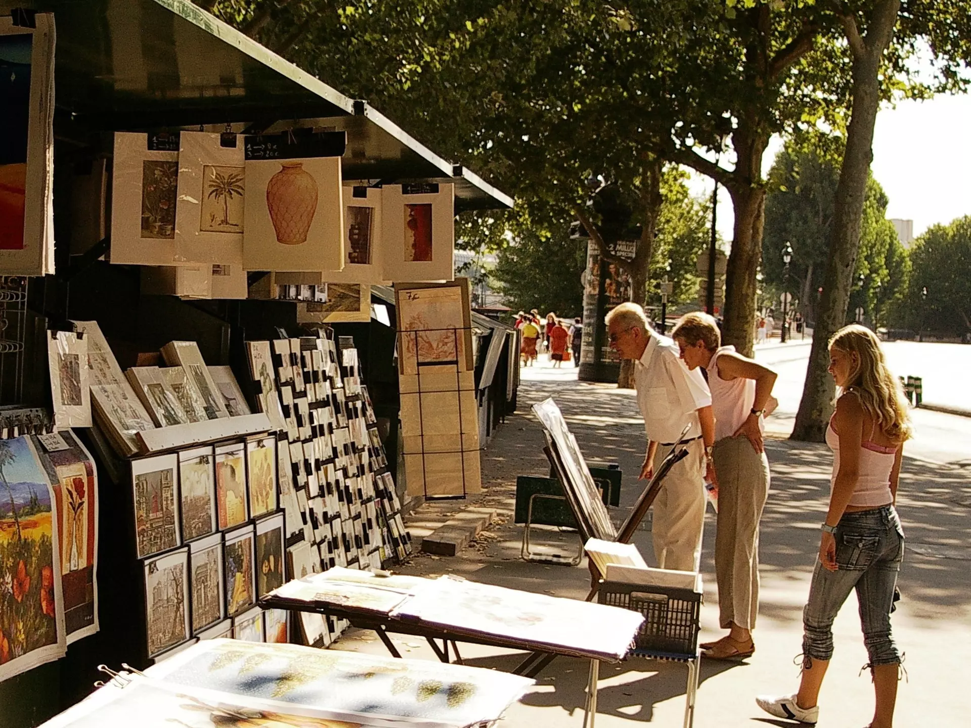 Sellers line the streets of Paris in sunny weather. Dana Ward / Shutterstock