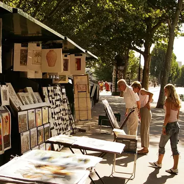 Sellers line the streets of Paris in sunny weather. Dana Ward / Shutterstock
