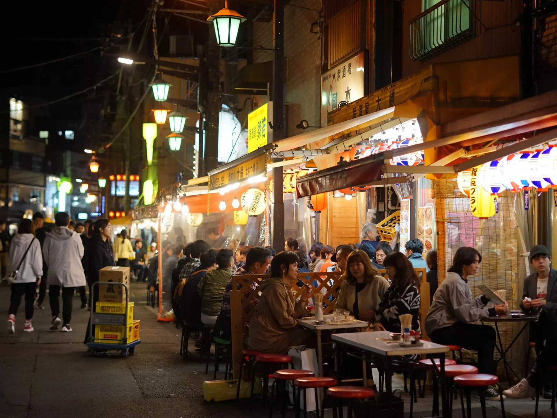 People dining at informal izakaya pubs in Asakusa, Tokyo. Japan. 