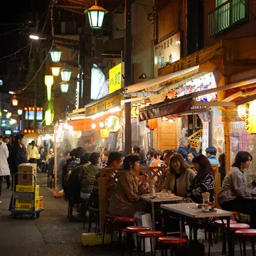 People dining at informal izakaya pubs in Asakusa, Tokyo. Japan. 