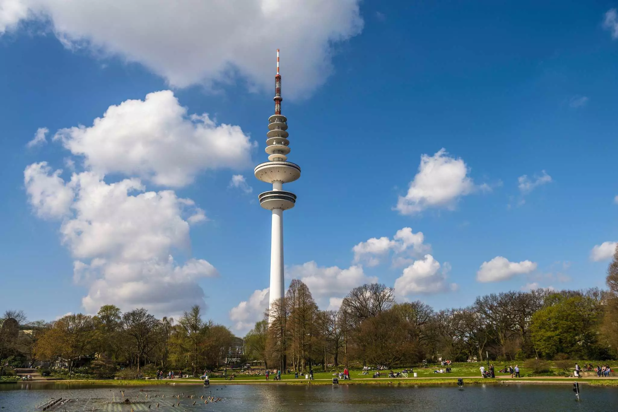 Lake Parksee at back the Hamburger television tower in Hamburg, Germany.