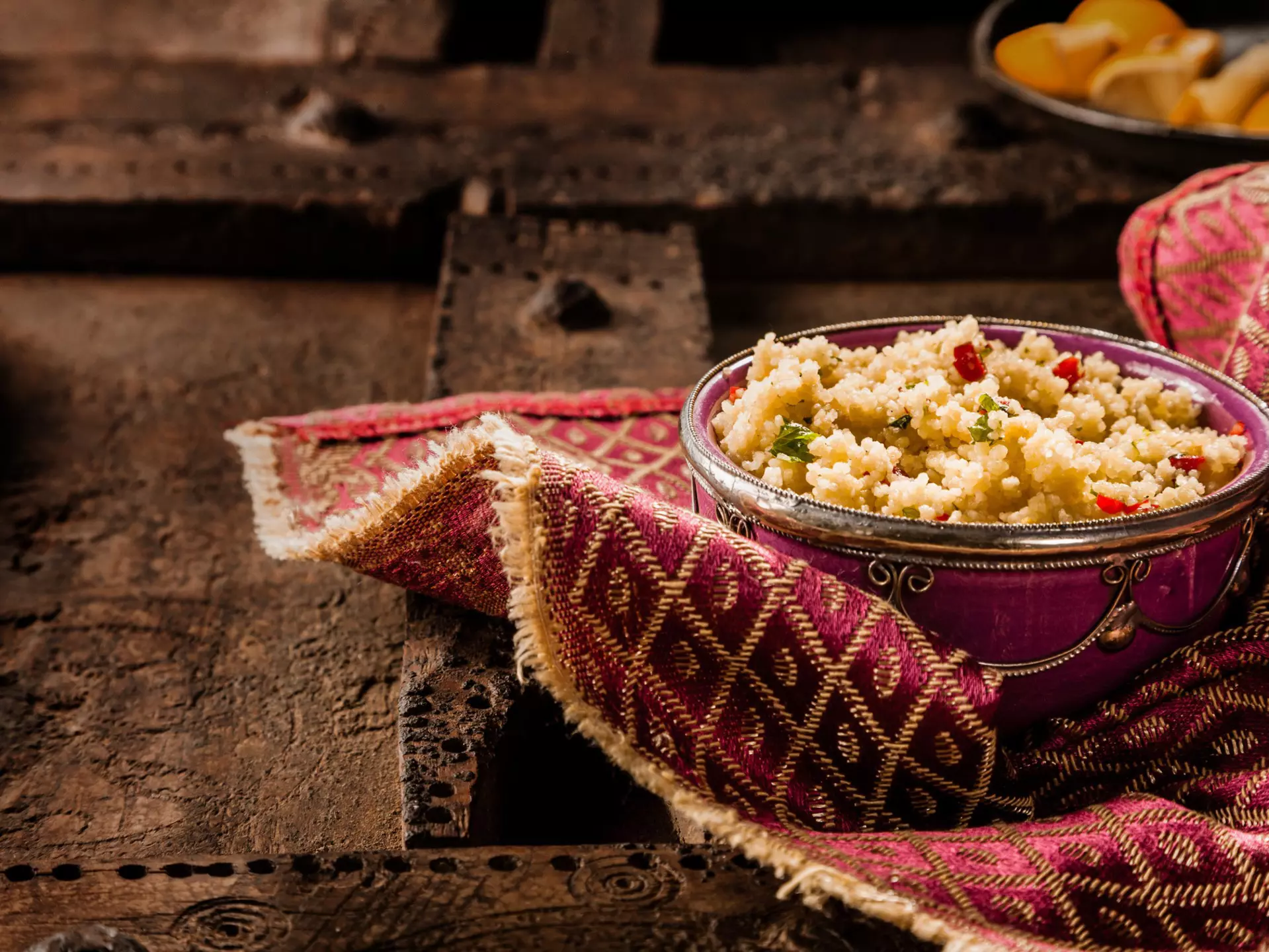 An ornate bowl of traditional Moroccan jeweled couscous.