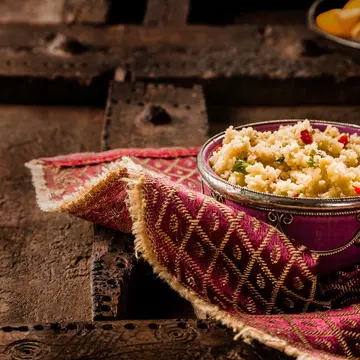 An ornate bowl of traditional Moroccan jeweled couscous.