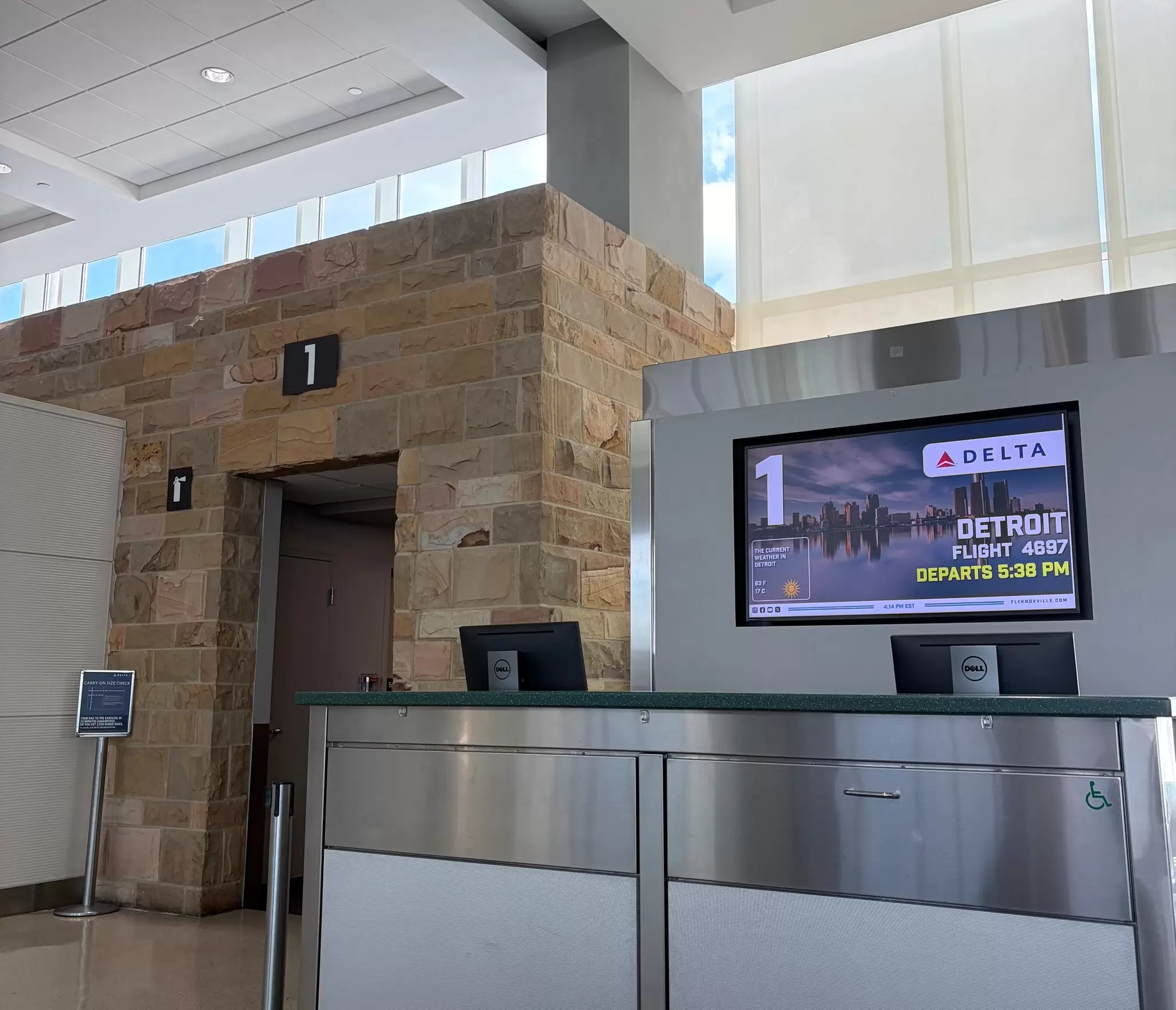 A gate at McGhee Tyson Airport in Knoxville, Tennessee. The screen beside the doorway says the Delta flight is going to Detroit