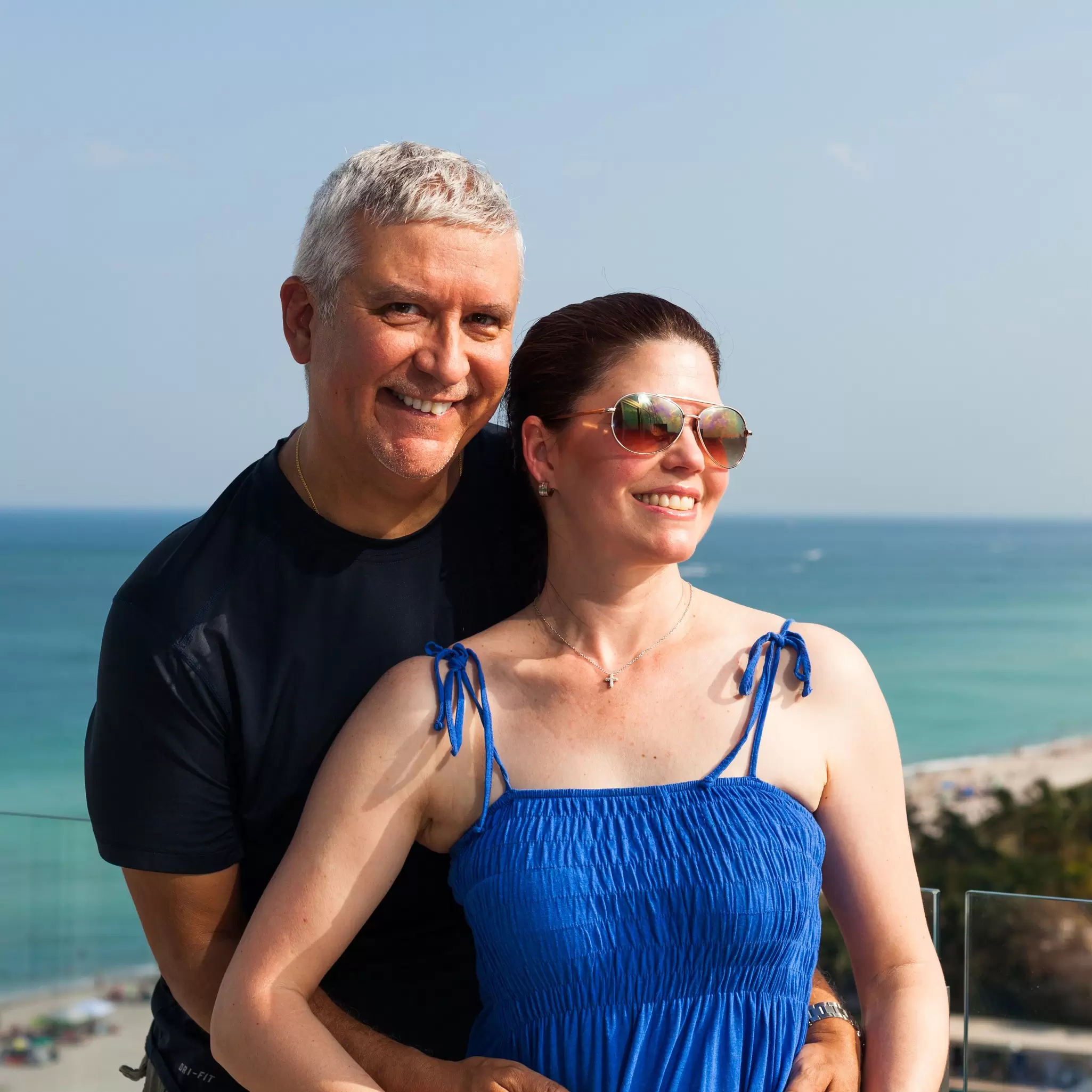 Happy middle age couple on a balcony overlooking Miami Beach., License Type: media, Download Time: 2025-03-24T15:49:12.000Z, User: Eointloughney87, Editorial: false, purchase_order: 56530 - Guidebooks, job: Global Publishing-WIP, client: Florida 11, other: Eoin T Loughney