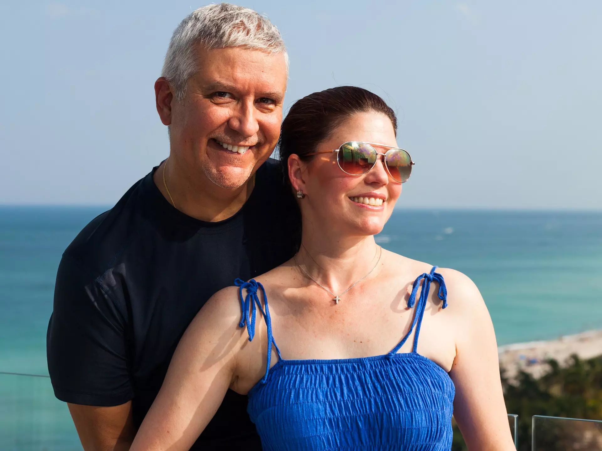 Happy middle age couple on a balcony overlooking Miami Beach., License Type: media, Download Time: 2025-03-24T15:49:12.000Z, User: Eointloughney87, Editorial: false, purchase_order: 56530 - Guidebooks, job: Global Publishing-WIP, client: Florida 11, other: Eoin T Loughney