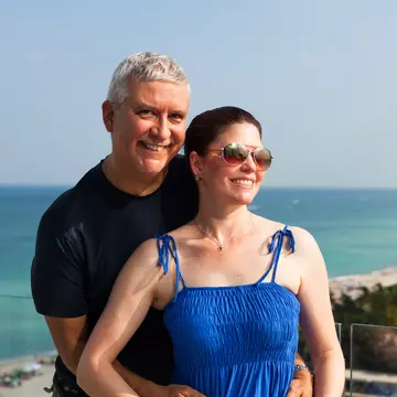 Happy middle age couple on a balcony overlooking Miami Beach., License Type: media, Download Time: 2025-03-24T15:49:12.000Z, User: Eointloughney87, Editorial: false, purchase_order: 56530 - Guidebooks, job: Global Publishing-WIP, client: Florida 11, other: Eoin T Loughney
