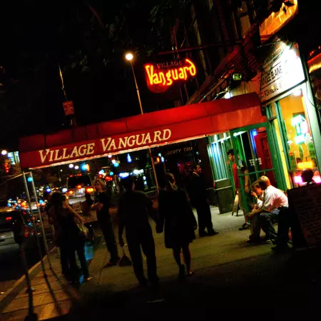 People mingling outside the Village Vanguard at night in the West Village