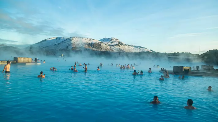 People bathing in Blue Lagoon, a geothermal bath resort in the south of Iceland