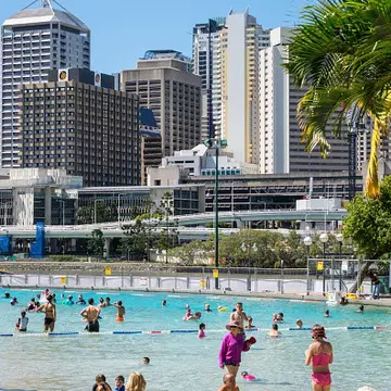 Australia, Queensland, Brisbane, Southbank Parklands Streets Beach sunbathers sand water Central Business District CBD city skyline skyscrapers buildings. (Photo by: Jeff Greenberg/Universal Images Group via Getty Images)
Brisbane Comp