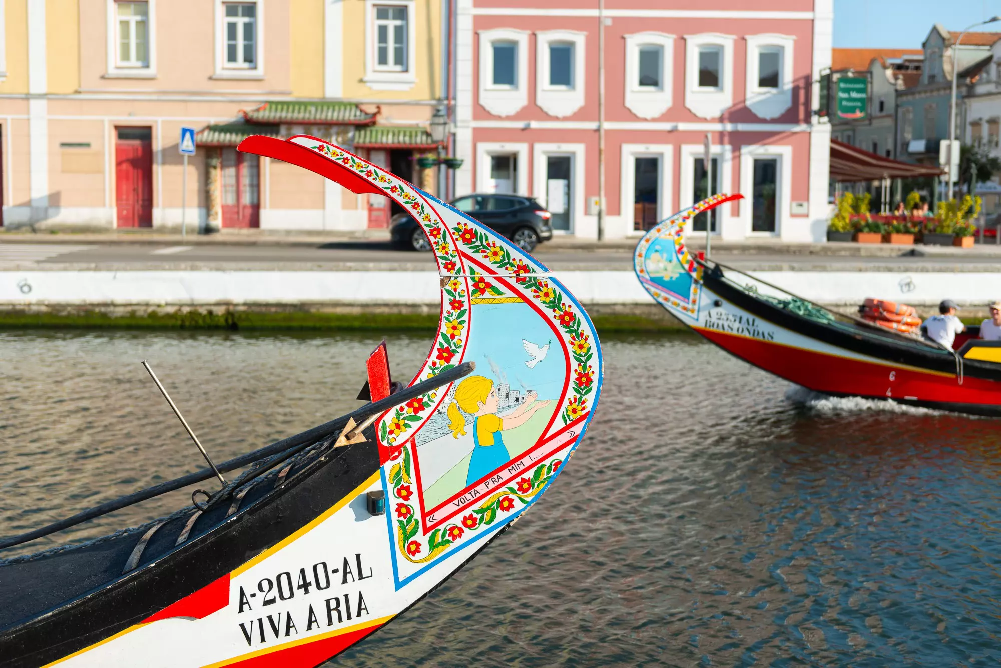 Colorful boats known as moliceiros ply the canals of Aveiro © Austin Bush / Lonely Planet