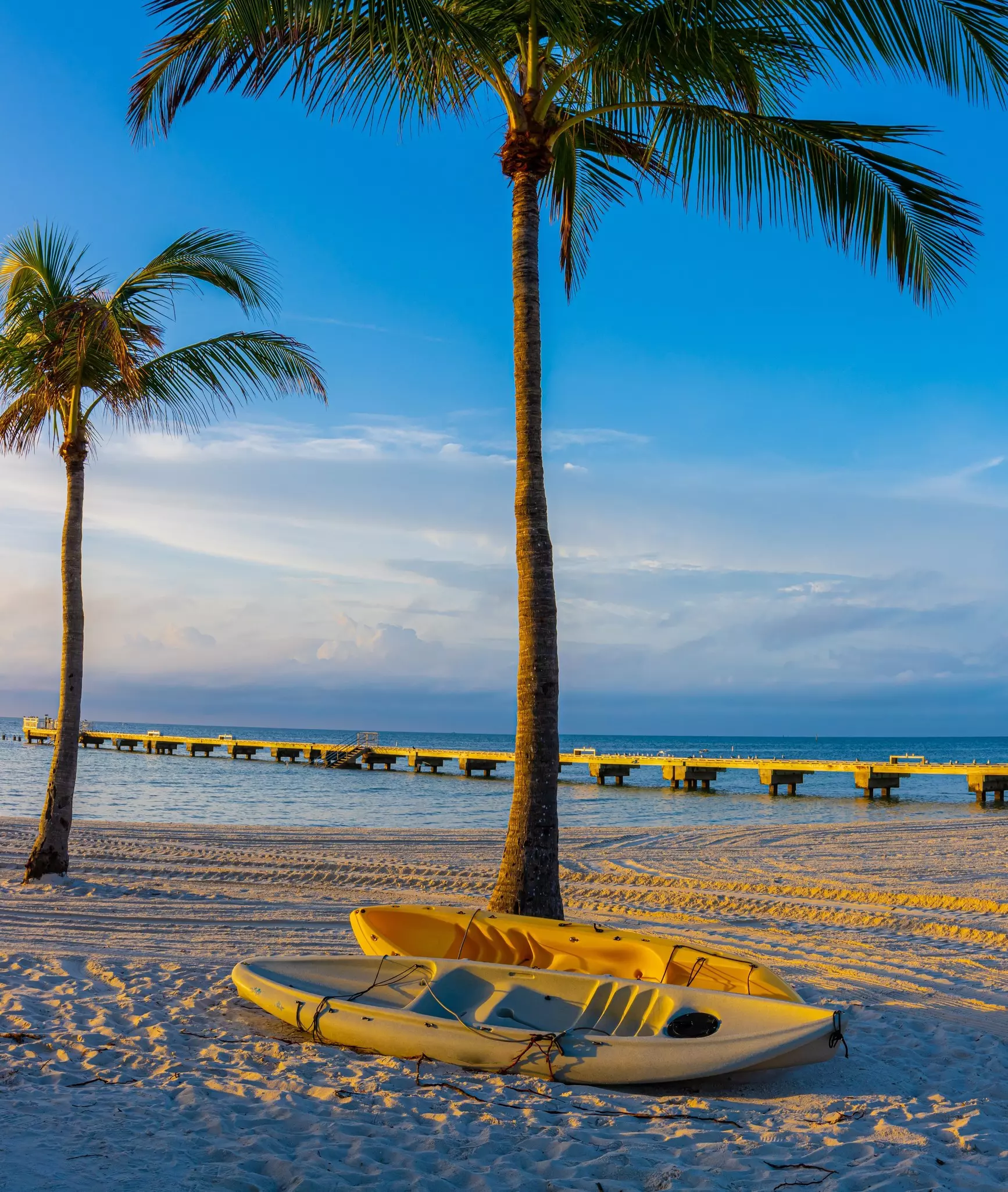 Kayaks On Sand Covered Beach at Higgs Beach Memorial Park, Key West, Florida, USA.