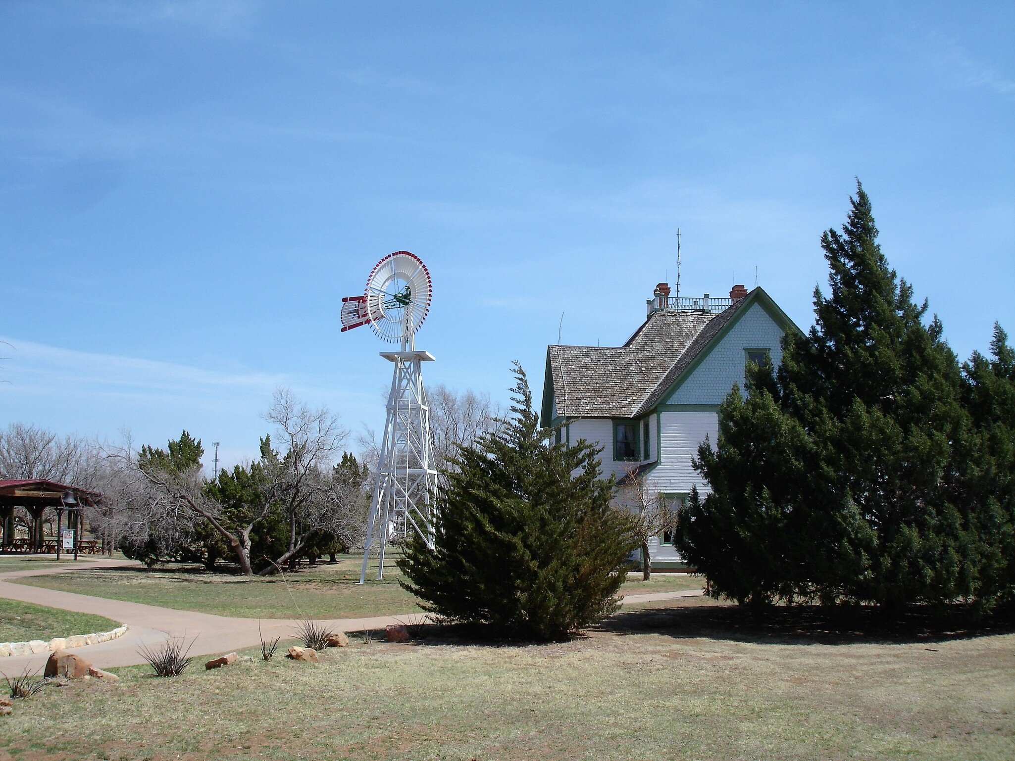 Water pumping windmill next to a historic house at the National Ranching Heritage Center in Lubbock, Texas; Shutterstock ID 1300920754;