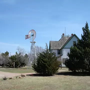 Water pumping windmill next to a historic house at the National Ranching Heritage Center in Lubbock, Texas; Shutterstock ID 1300920754;