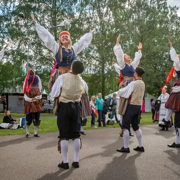Estonian folk dancers in traditional clothing at the Singing Festival