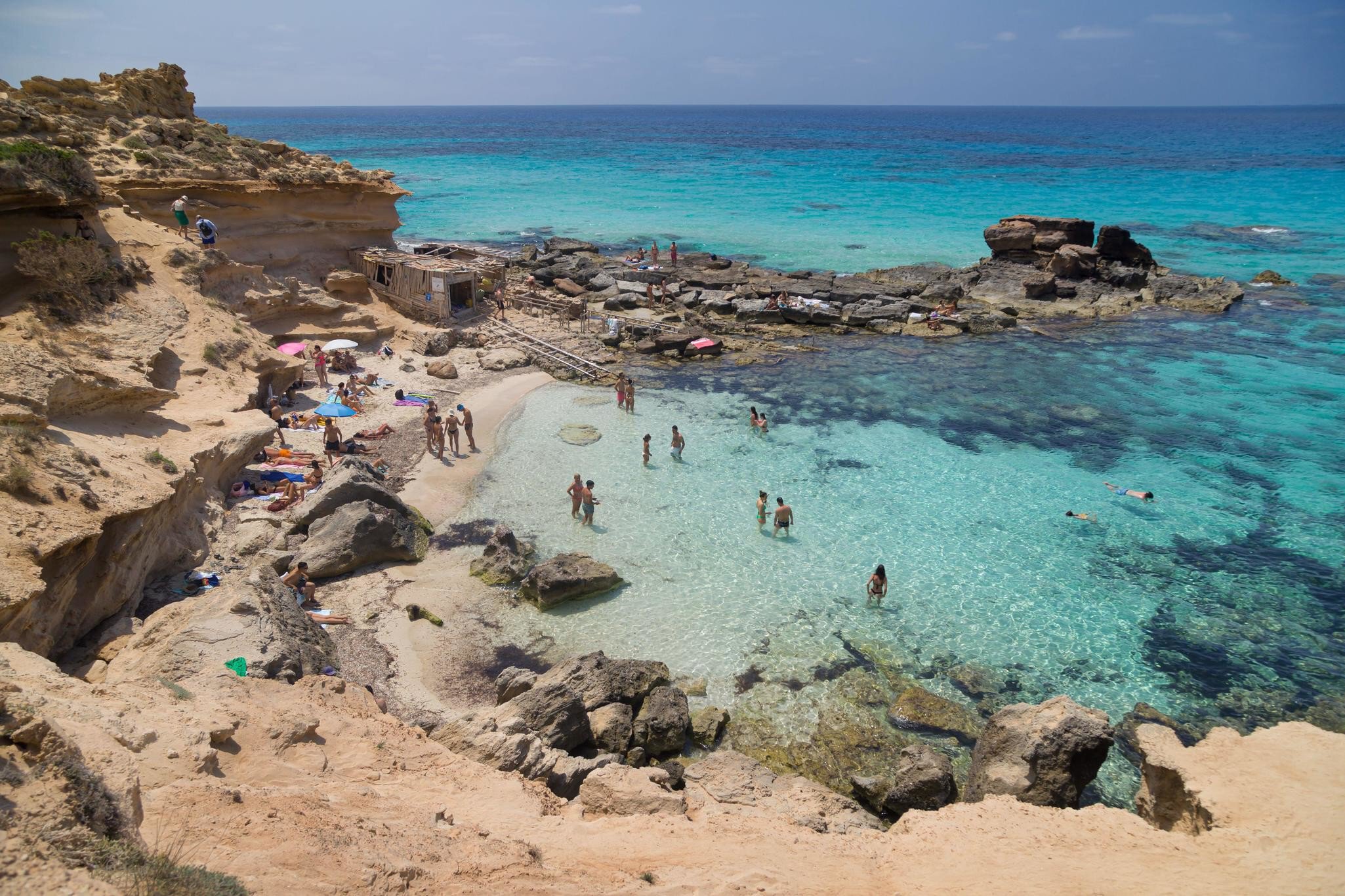 Formentera, Spain - June 7, 2025: Turquoise Waters at Calo des Mort in Formentera, Balearic Islands, Spain.