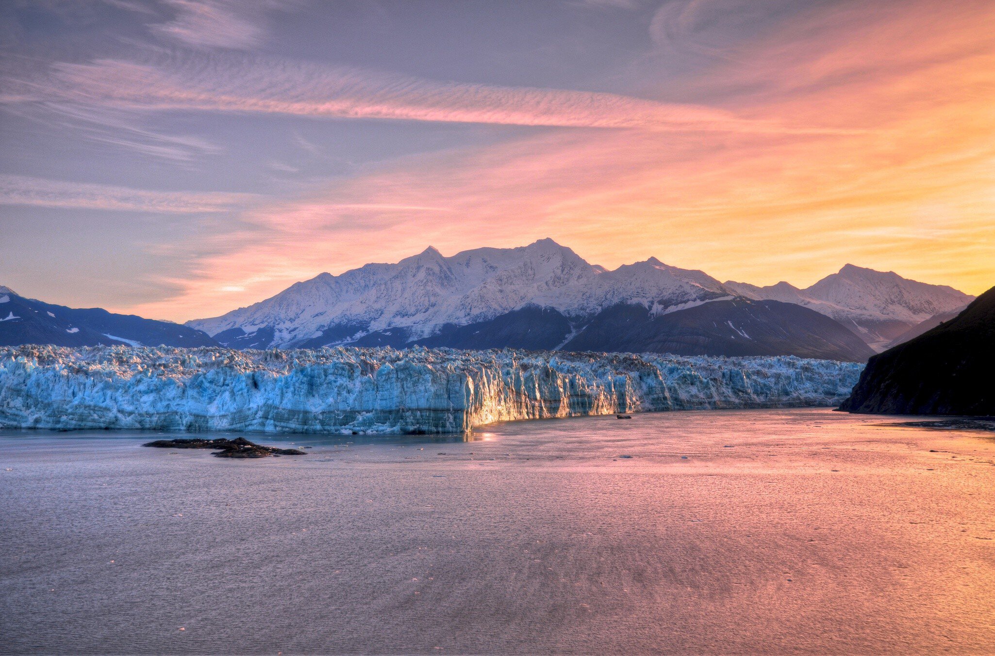 Sunrise over the Hubbard Glacier and surrounding mountains in Alaska