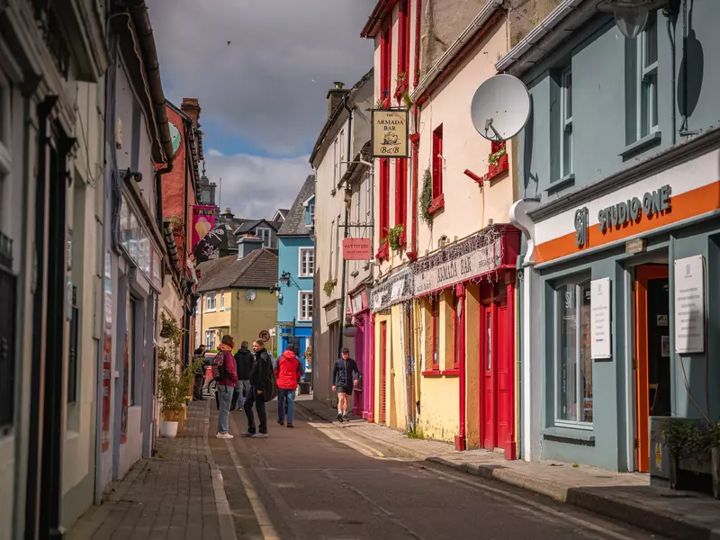 People walking through the center of a small town