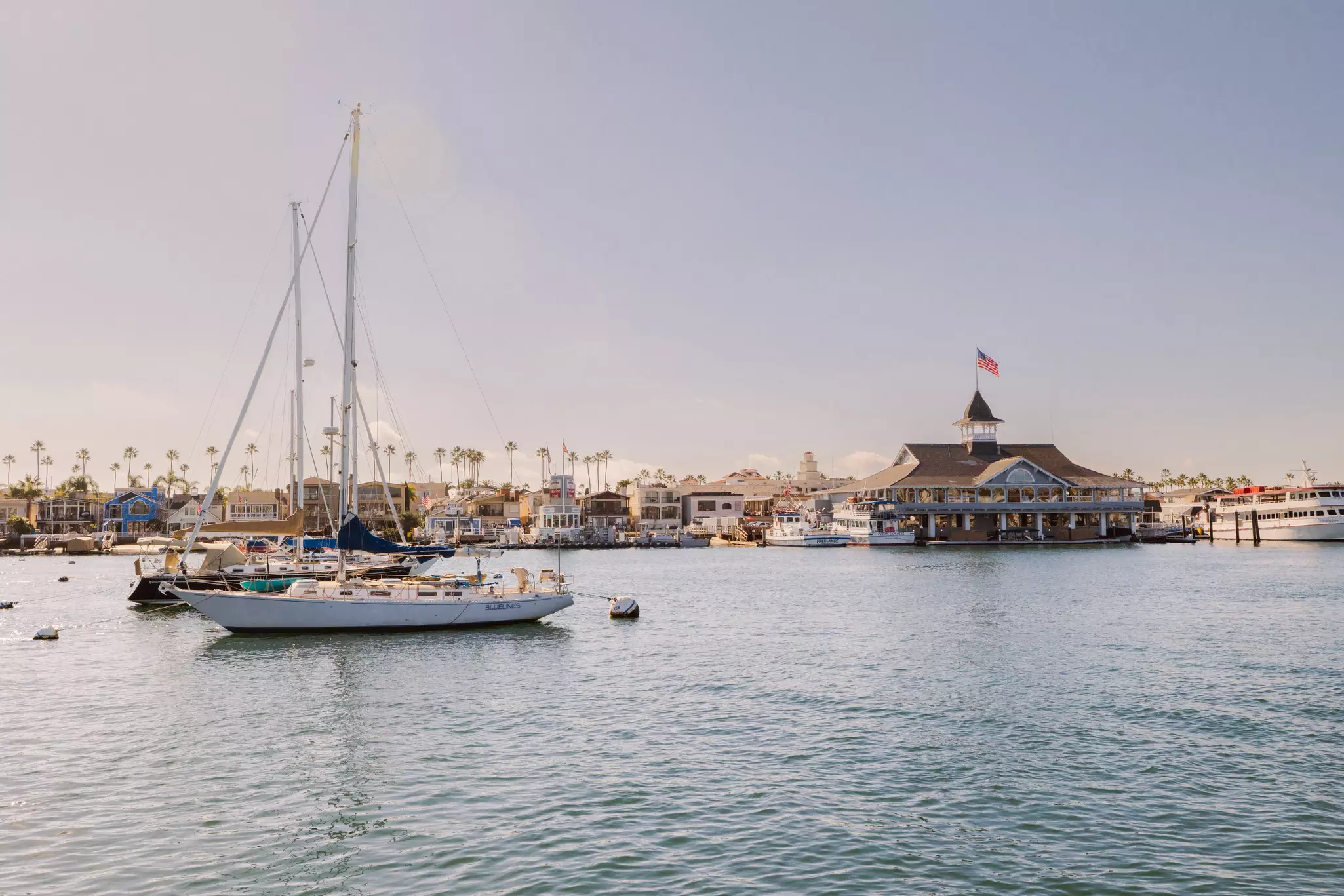 A sailing boat in a pretty harbor
