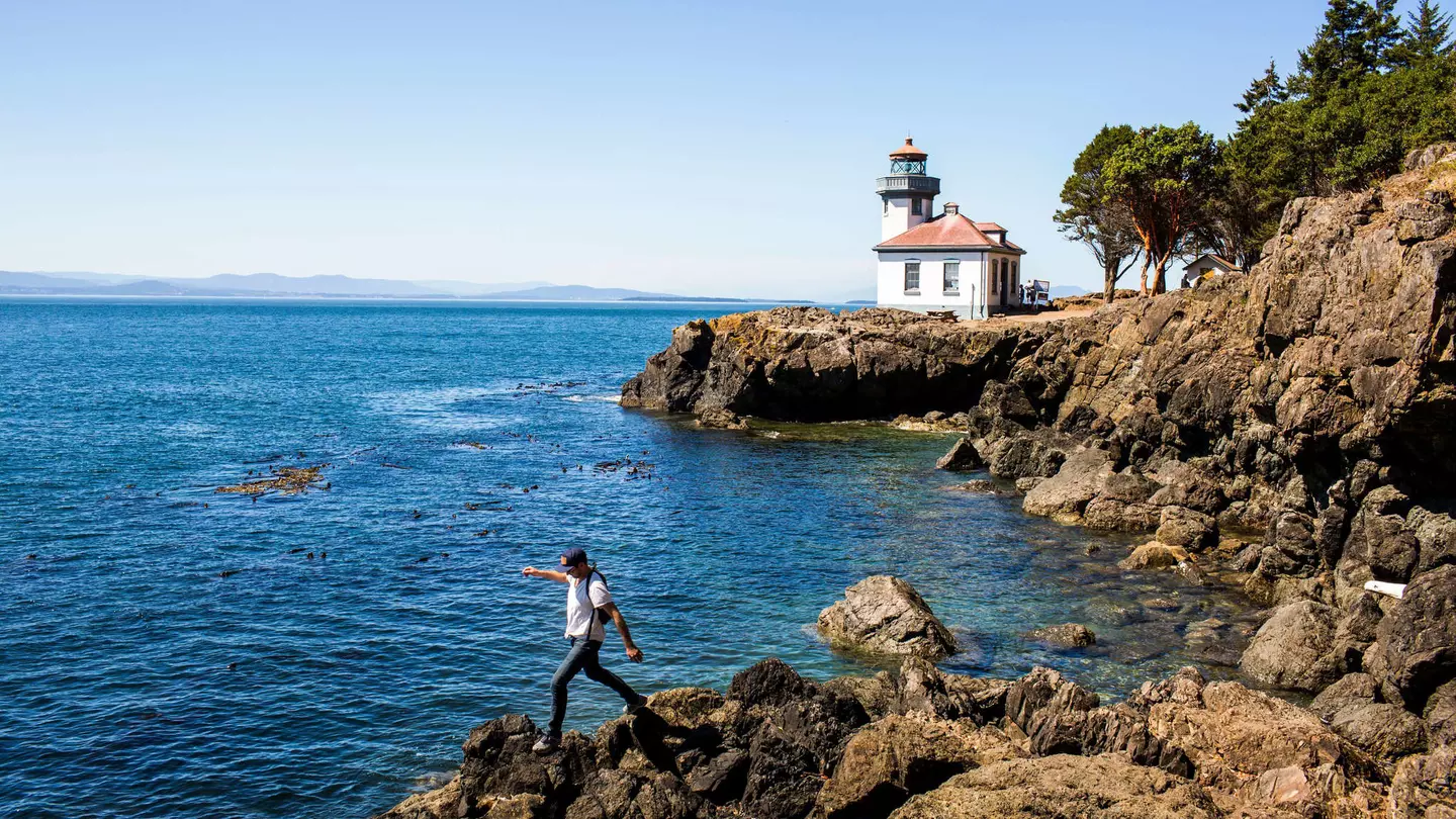 Caucasian man walking on rocks near the lighthouse on San Juan Island, Washington
shoreline, person, scenery, panoramic, nature, sea, lighthouse, coast, San Juan Island, Washington