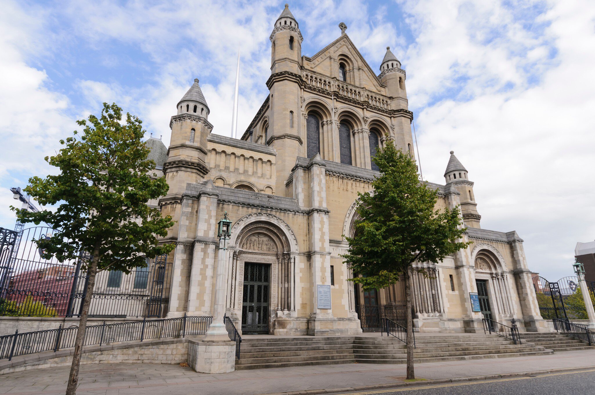 Exterior of Saint Anne's Cathedral in Belfast, Ireland.  Blue sky above.