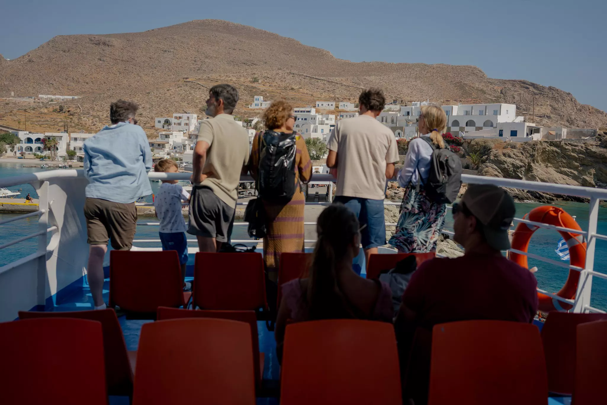 Tourists on a ferry at Folegandros Island, Greece.