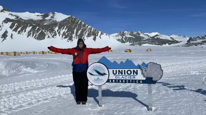 A large truck with wheels adapted for snowy terrain.