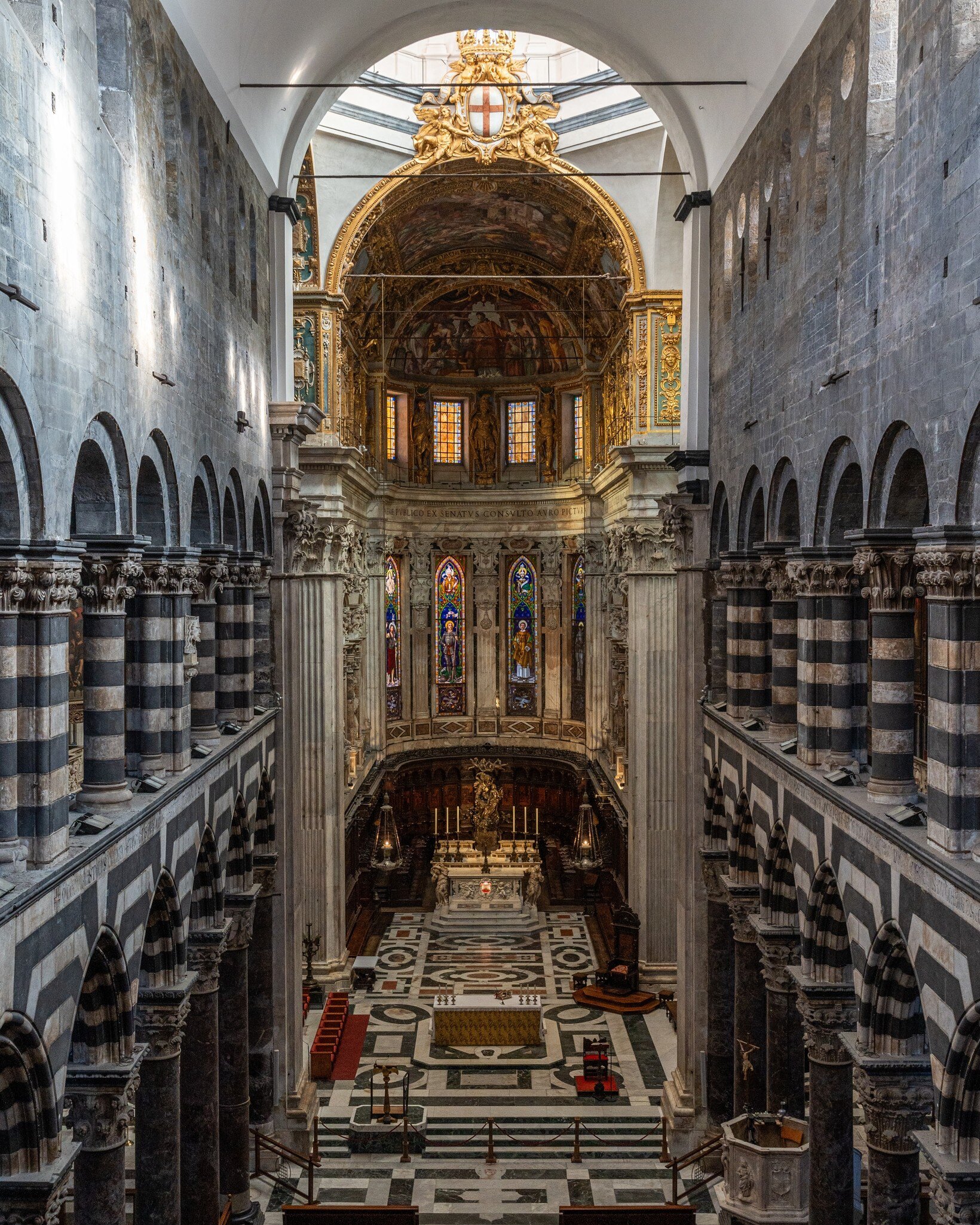 Grand interior of Genova Cathedral with high vaulted ceiling, Liguria, Italy.