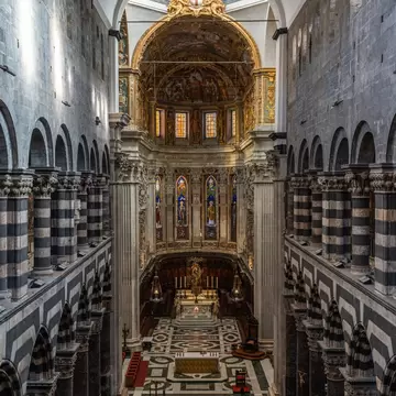 Grand interior of Genova Cathedral with high vaulted ceiling, Liguria, Italy.