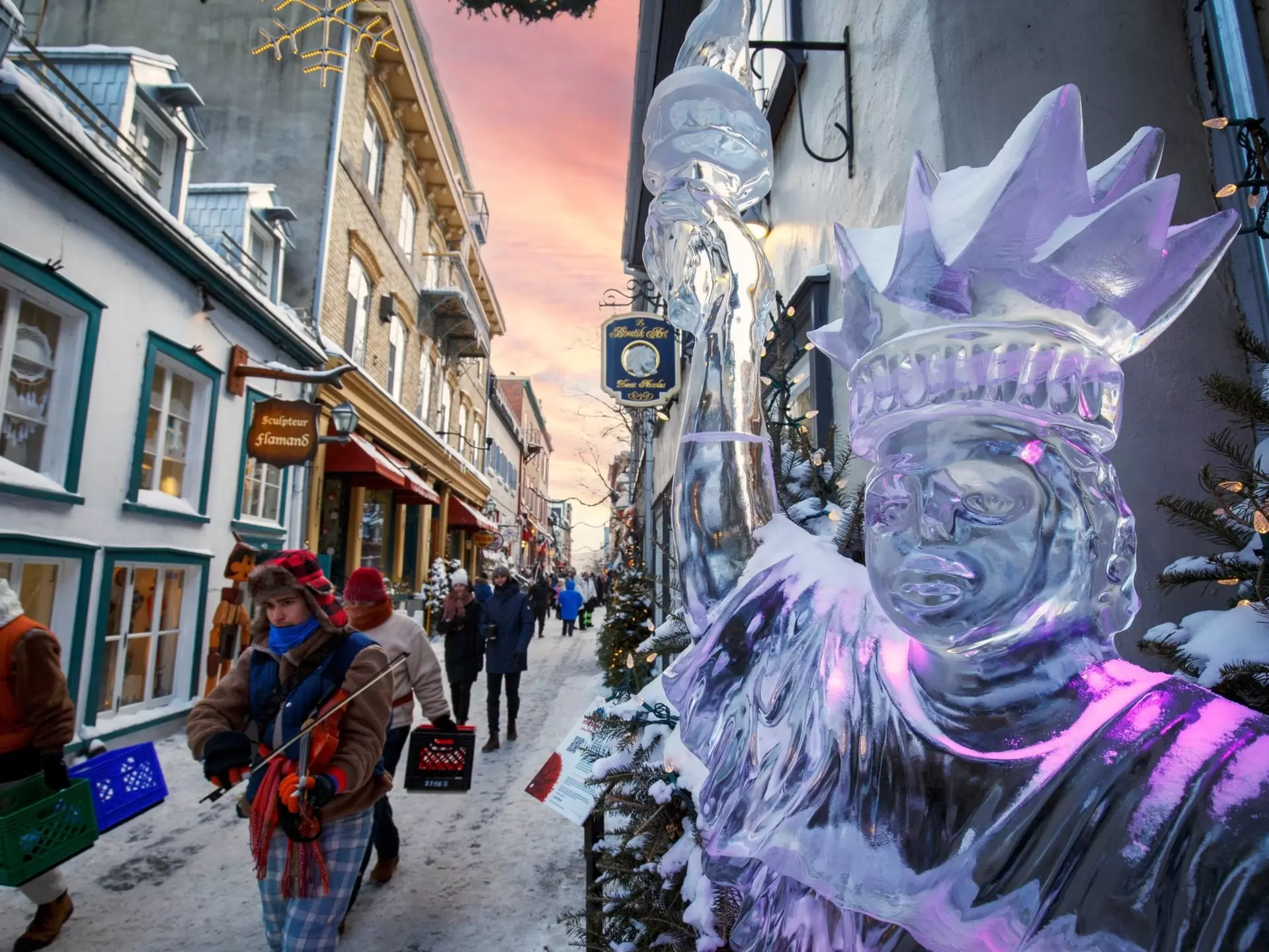 Vertical view of illuminated ice sculpture at the winter carnival in Québec City, Canada.