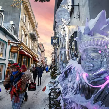 Vertical view of illuminated ice sculpture at the winter carnival in Québec City, Canada.
