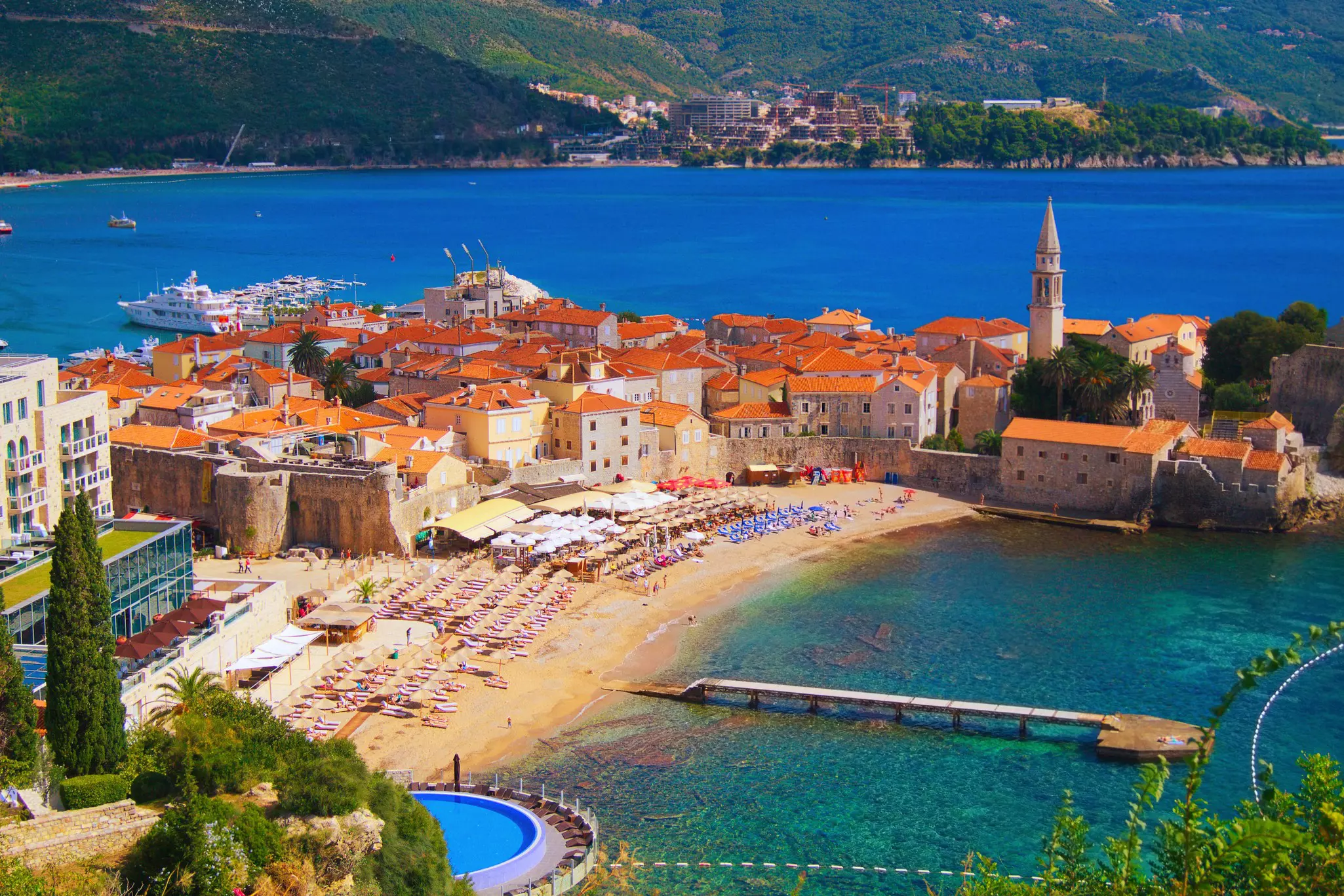 View of the sea and the beach and Old Town of Budva in Montenegro.