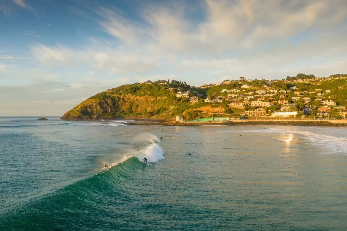 Morning surfers in St Claire. Dunedin NZ