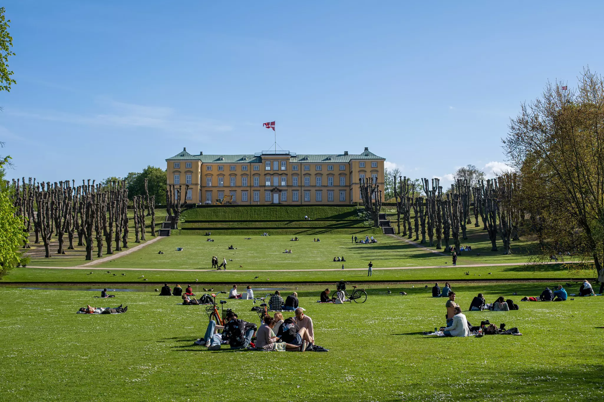 People on the lawn at Frederiksberg Have in Copenhagen, Denmark