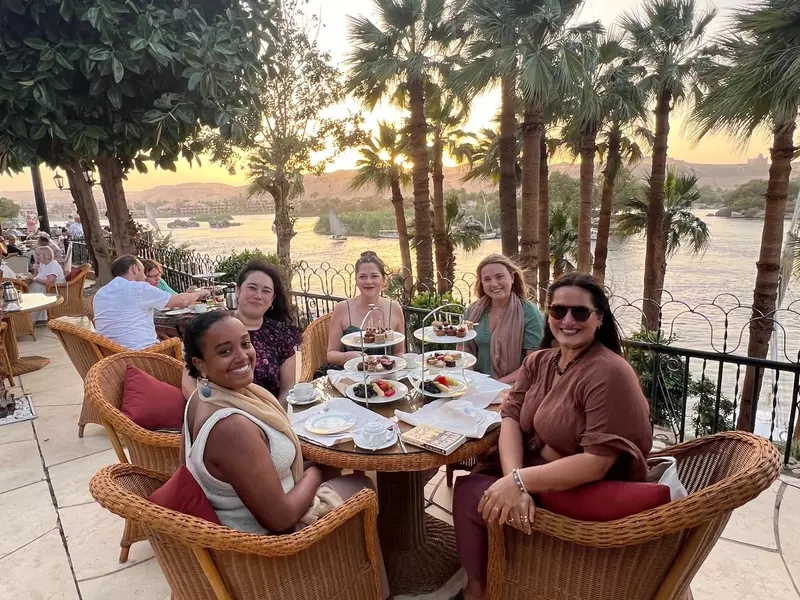 Jessica Lockhart with traveling companions having high tea at the Cataract Hotel along the Nile in Egypt