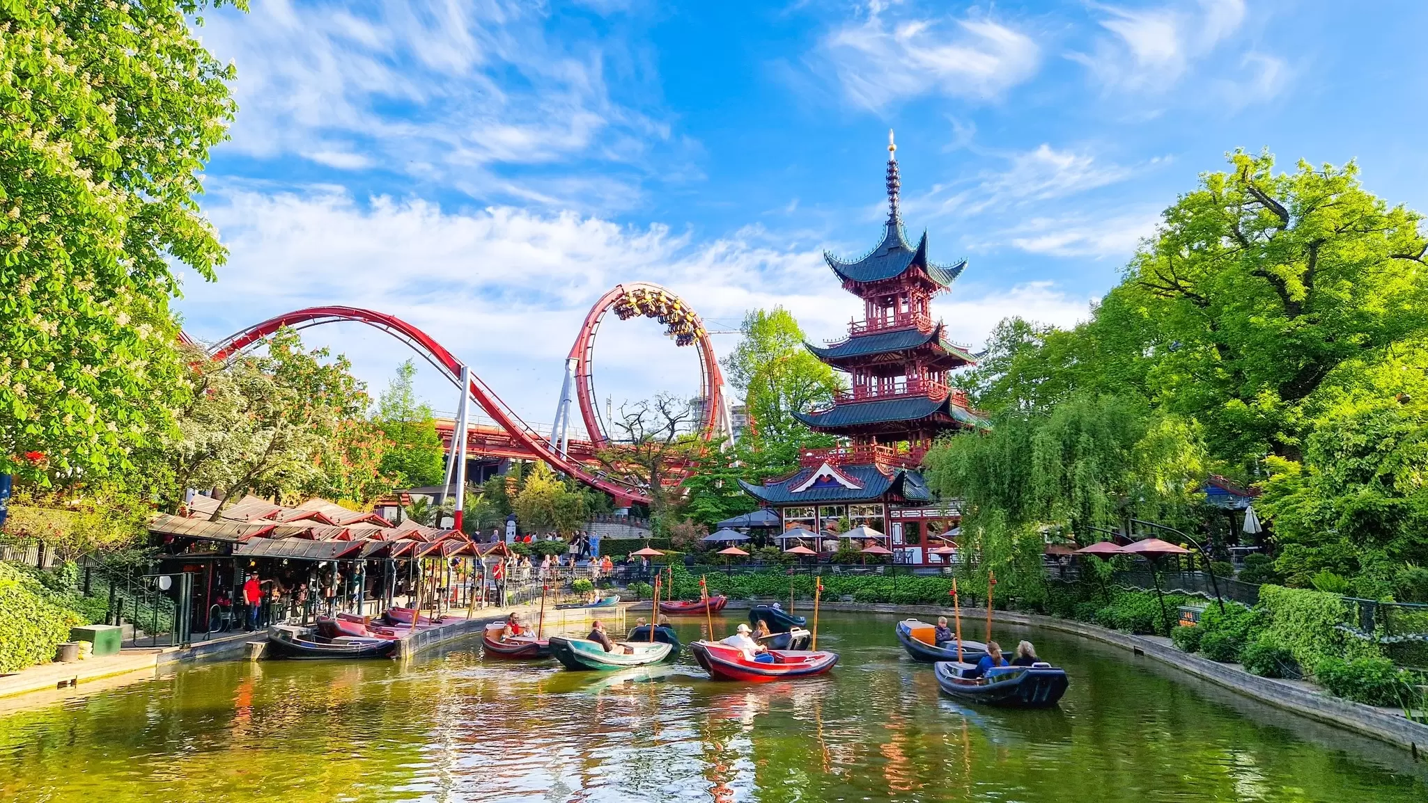 View of boats on the lake at Tivoli Gardens in Copenhagen, Denmark.