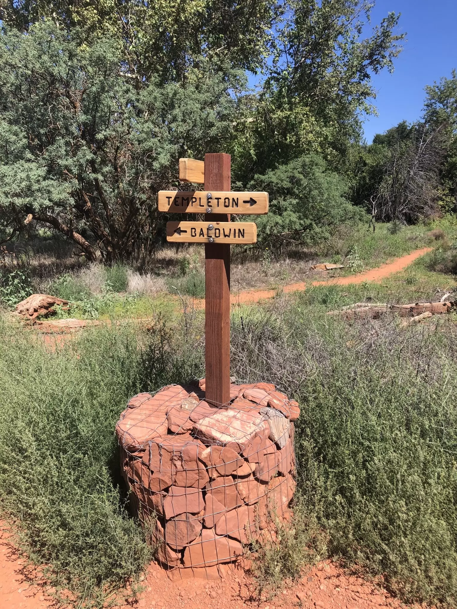 A trail marker reading "Templeton" and "Baldwin"