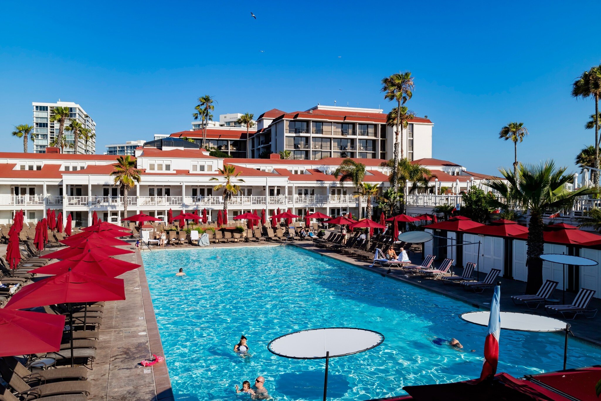 San Digeo, MAY 28 2015 - Sunny view of the swimming pool of Historical Hotel del Coronado, License Type: media, Download Time: 2025-02-07T15:13:24.000Z, User: Ppeterson948, Editorial: true, purchase_order: 56530 - Guidebooks, job: Global Publishing WIP, client: Global Publishing WIP, other: Pia Peterson Haggarty
