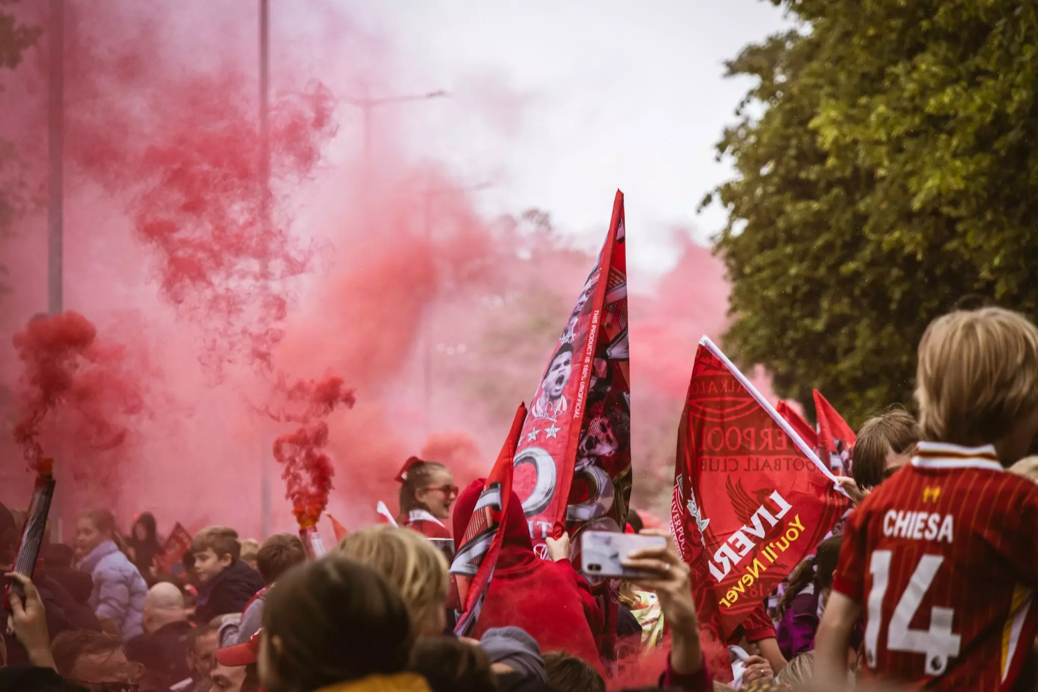 Fans dressed in red crowd the streets in celebration