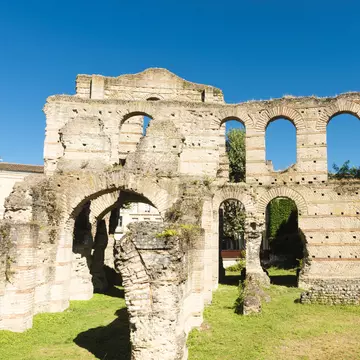 Palais Gallien in Bordeaux, France, are ruins of an old roman amphitheater. The shape of the huge amphitheater, which would have been able to hold about 15,000 spectators, is largely covered over by development.