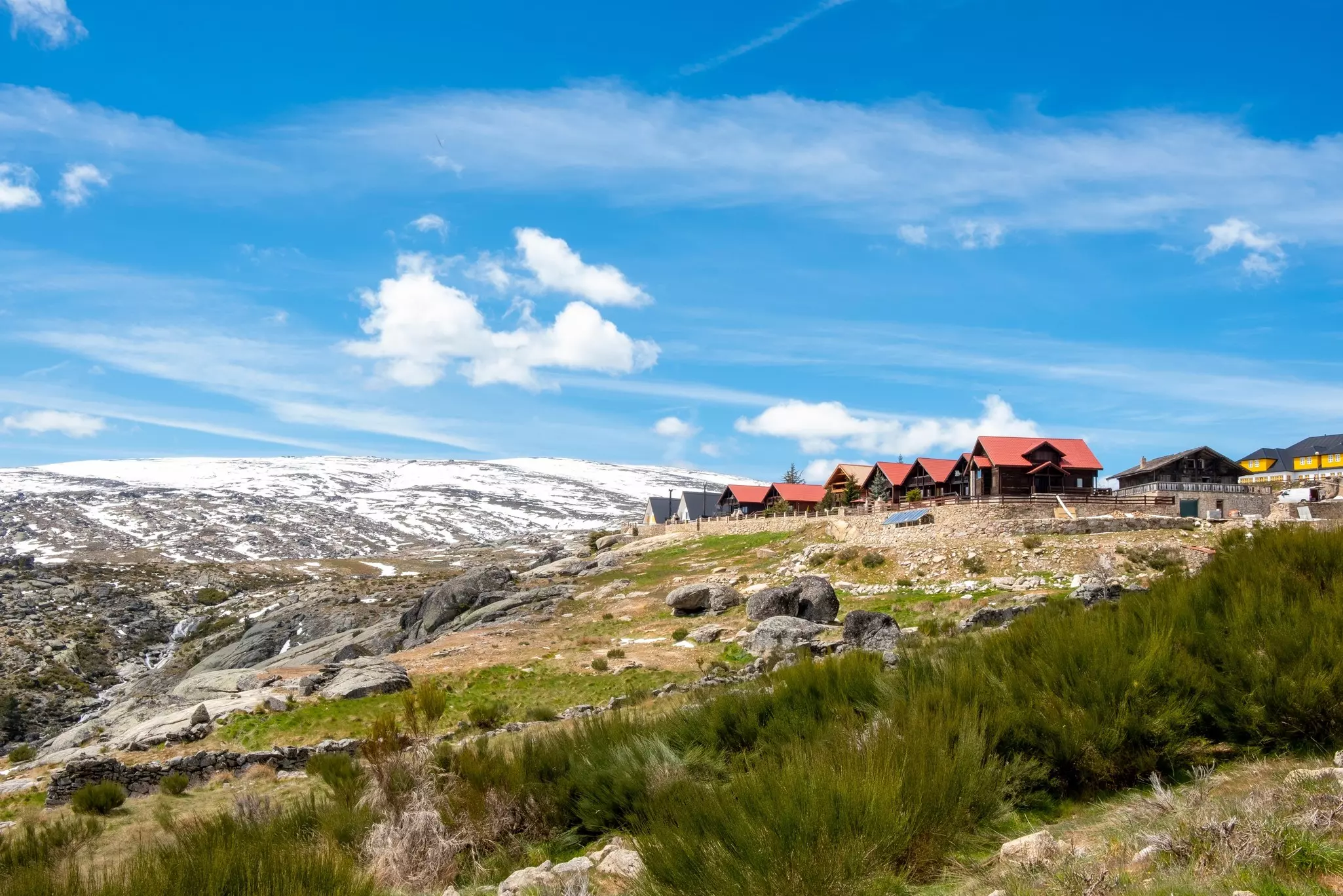 A mountain town surrounded by snow-covered hills.
