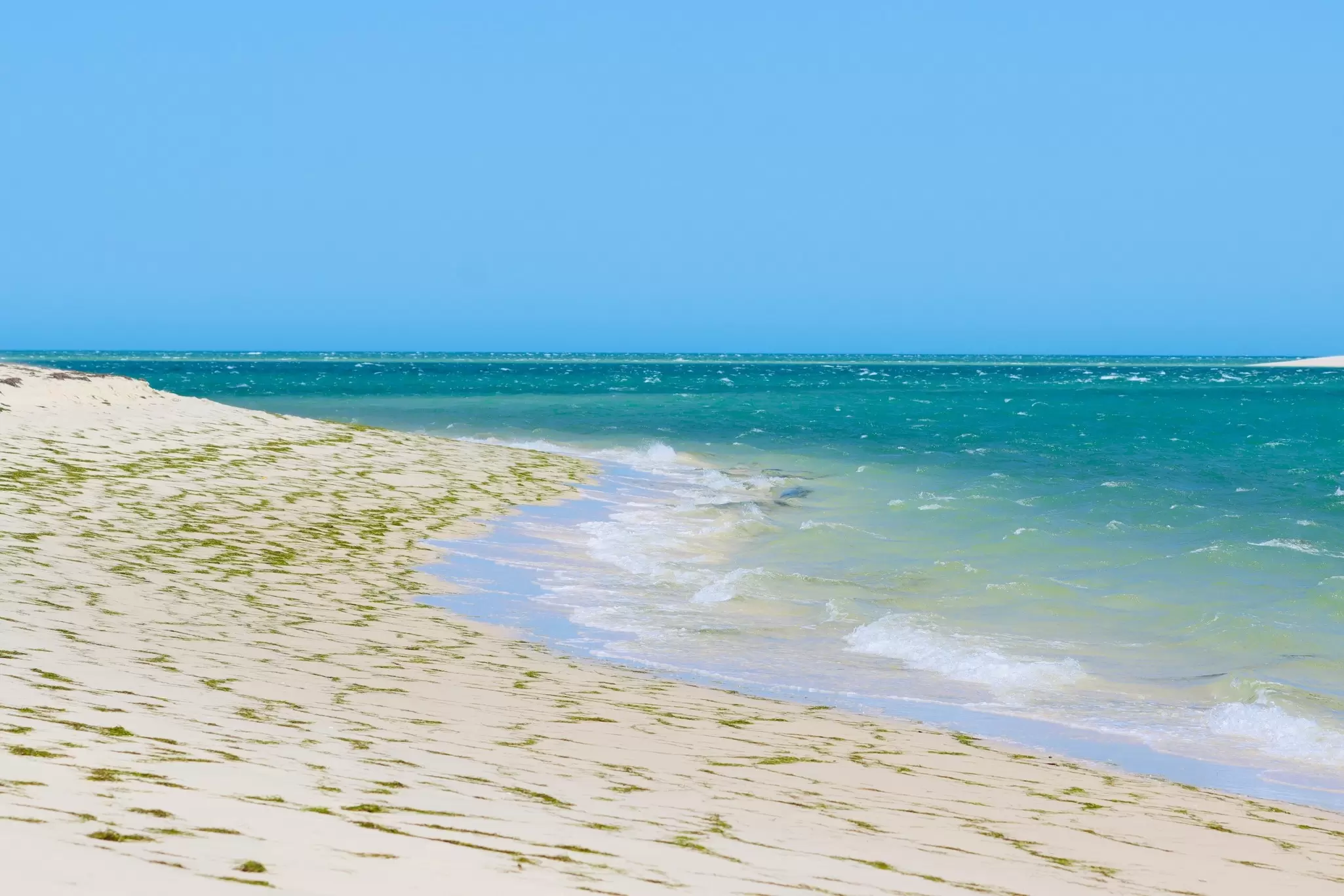 View of a beach on Armona Island on a sunny day in the Ria Formosa, Portugal.