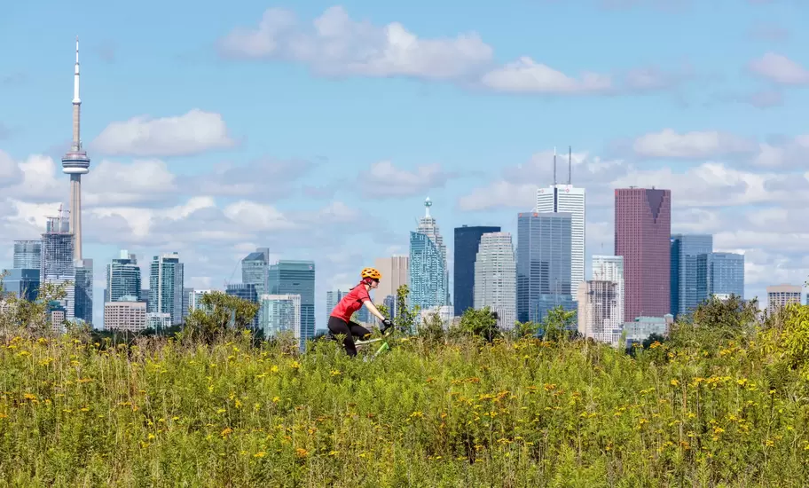 Cycling in front of the skyline from Tommy Thompson Park in Toronto Ontario Canada.