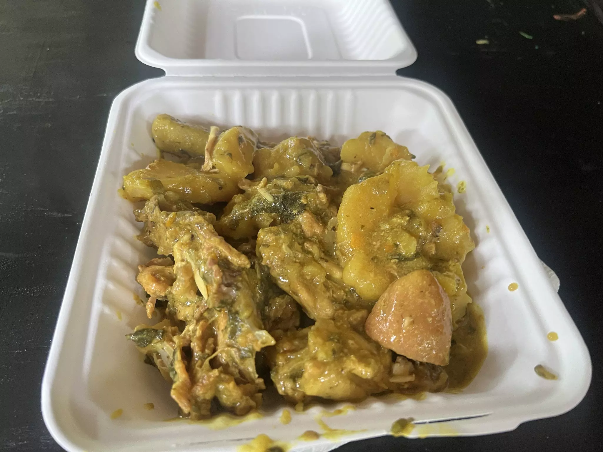 Oil down is Grenada's national dish. It's a hearty stew, filled with cassava, pig tail, chicken, coconut milk and spices.