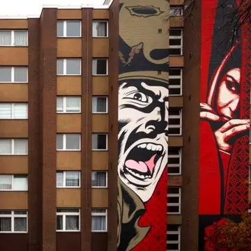 Two artworks by Shepard Fairey along Bülowstrasse in Berlin
