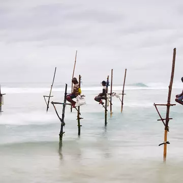 Sri Lanka, Weligama, Stilt fishermen on the coast