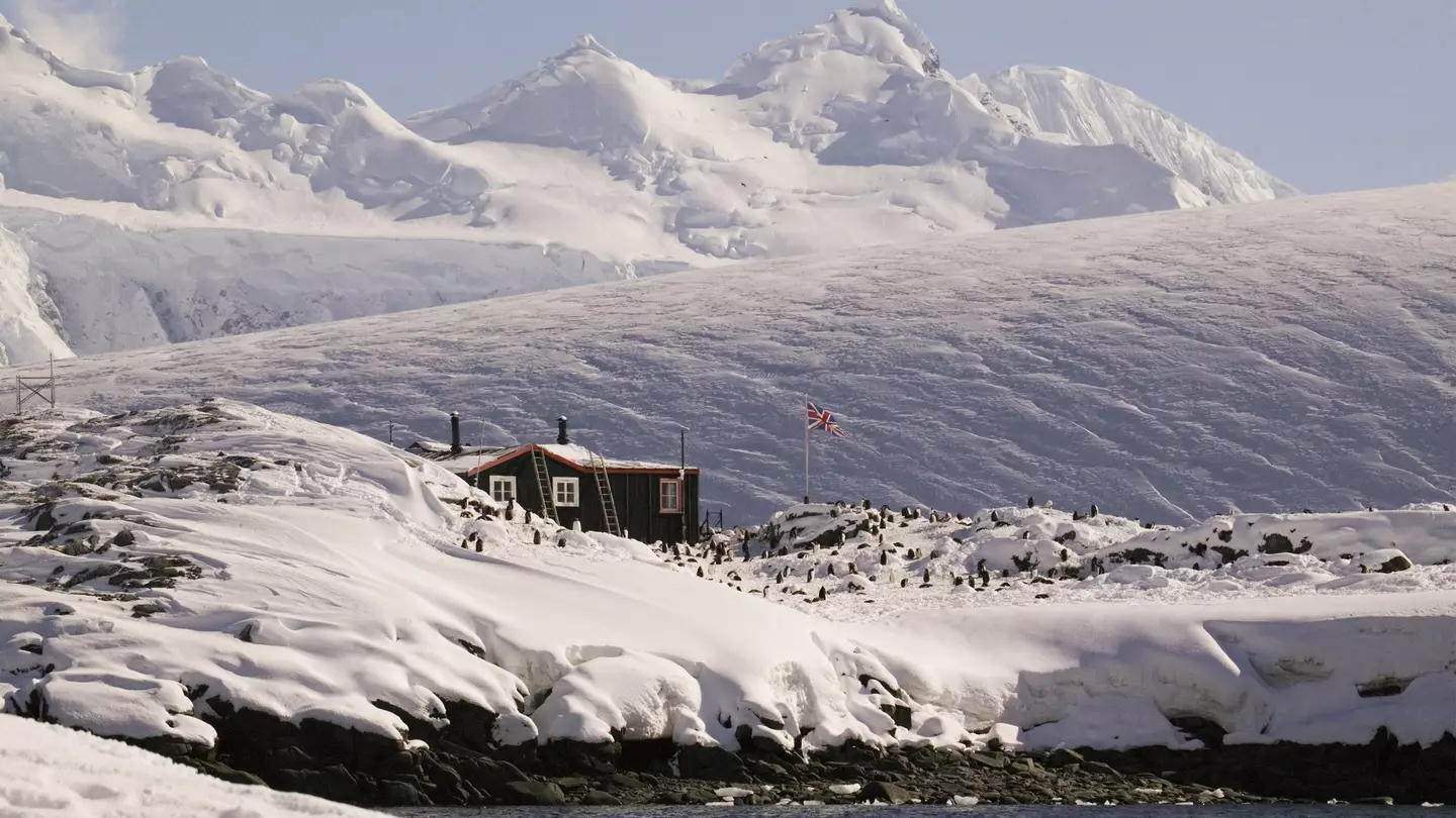 Far away shot of the Antarctic peninsula, Goudier Island, Old British Base at Port Lockroy, Bransfield House
