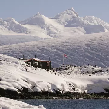 Far away shot of the Antarctic peninsula, Goudier Island, Old British Base at Port Lockroy, Bransfield House