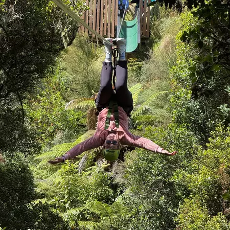 Lonely Planet editor Melissa Yeager ziplining in Rotorua, New Zealand.